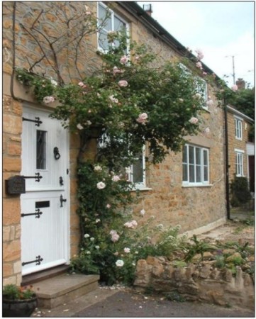 Cottage front view with roses